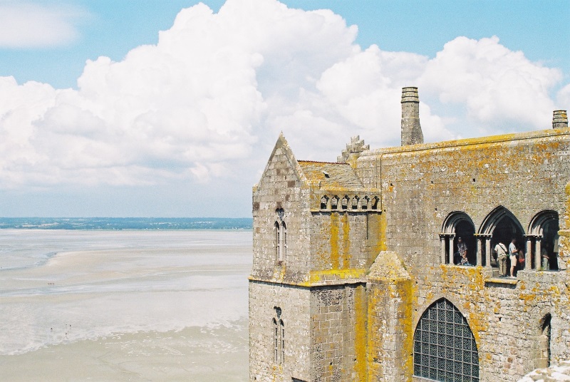 Abbey Mont-Saint-Michel in Normandy boasts commanding views of the French coastline, nearby islets, and the distant sea.