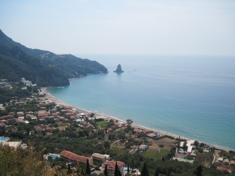 A road to sandy Agios Gordios Beach goes through the homonymous resort town, allowing photo shots from various viewpoints.