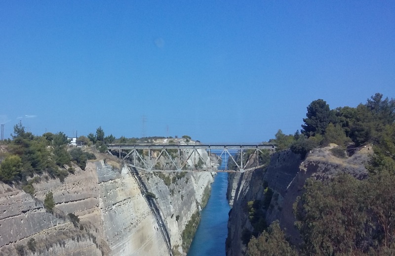 Corinth Canal, edged by high cliffs and spanned by bridges, is the shortcut between the Ionian and the Aegean seas, Greece.