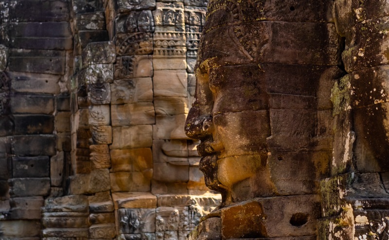 Visiting Bayon Temple in Angkor Thom, featuring many smiley faces, is among the top things to do in Cambodia for travelers.