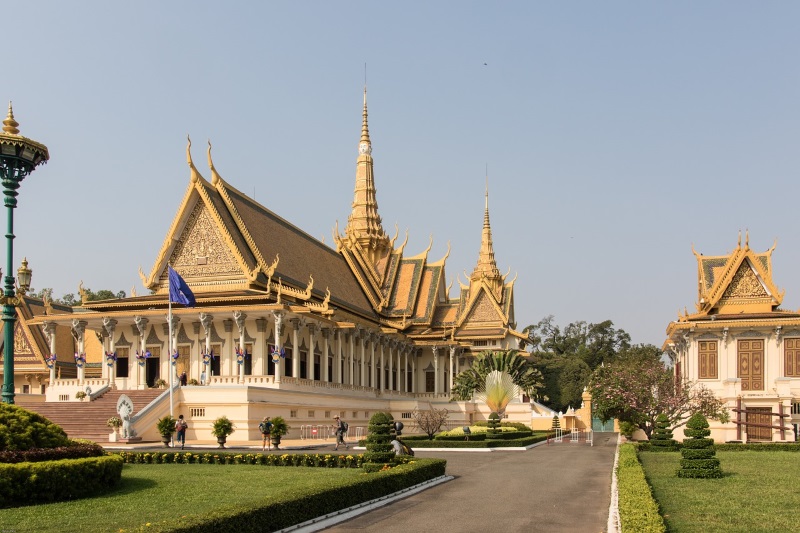 Royal Palace in Phnom Penh is a king's official residence, featuring structures with gilded rooftops and manicured gardens.